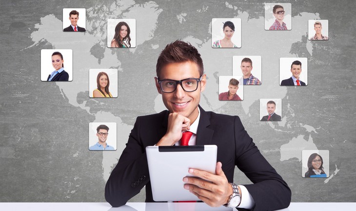 smiling business man with tablet pad networking